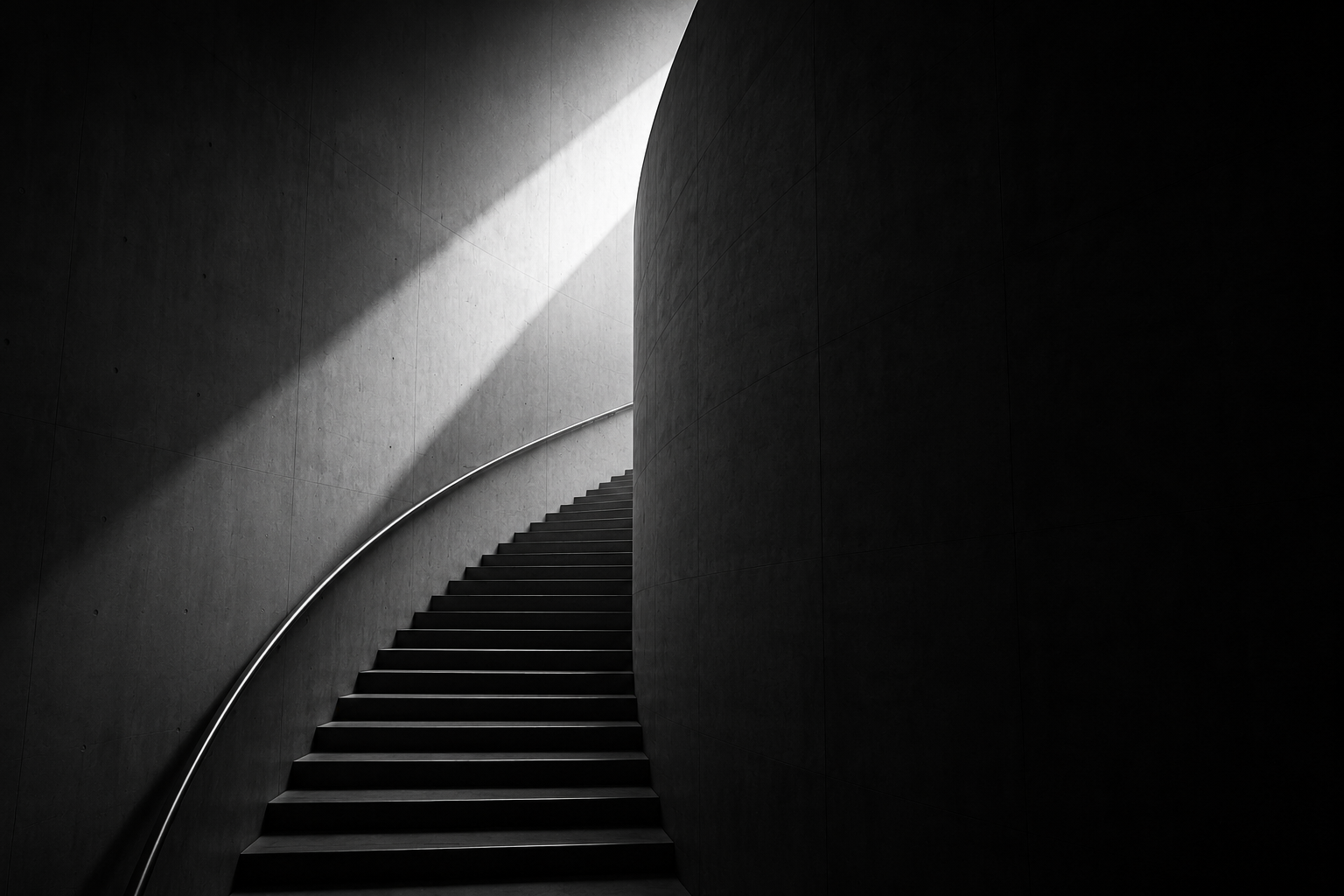 Concrete staircase rising through light